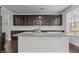 Kitchen island with granite countertop, subway tile backsplash and stainless steel appliances at 1800 Bodwin Ln, Apex, NC 27502