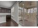 Kitchen view to the deck, featuring dark cabinetry, hardwood floors, and granite countertops at 1800 Bodwin Ln, Apex, NC 27502