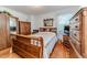 Charming bedroom featuring a decorative bed frame, hardwood floors, and lots of storage at 201 Colonial Ave, Goldston, NC 27252