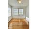 Inviting room featuring natural light and wood flooring, creating a warm and welcoming atmosphere at 201 Colonial Ave, Goldston, NC 27252