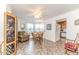 Cozy dining area featuring a round table, an accent chair, and an open view to the kitchen at 201 Colonial Ave, Goldston, NC 27252