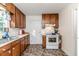 Well-lit kitchen features essential appliances, and ample counter space at 201 Colonial Ave, Goldston, NC 27252