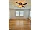 Spacious room with hardwood floors, paneled ceilings, fan and bright natural light at 201 Colonial Ave, Goldston, NC 27252