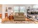 Living room filled with natural light, comfortable furniture, and tasteful decor at 201 Colonial Ave, Goldston, NC 27252