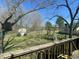 Backyard view from the deck, showcasing a play area and well-maintained lawn at 214 Grace St, Oxford, NC 27565
