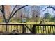Spacious backyard features a wooden deck, shed, and a play area, perfect for outdoor activities at 214 Grace St, Oxford, NC 27565
