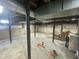 Unfinished basement with support beams and some boxes for storage at 214 Grace St, Oxford, NC 27565