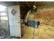 Basement featuring a white door and exposed brick at 214 Grace St, Oxford, NC 27565