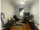 Bedroom featuring hardwood floors, natural light and adequate space for a work and lounge area at 214 Grace St, Oxford, NC 27565