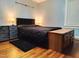 A spacious bedroom featuring hardwood floors, natural light and unique furnishings at 214 Grace St, Oxford, NC 27565