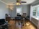 A charming dining room with hardwood floors, neutral walls, and a stylish high-top table at 214 Grace St, Oxford, NC 27565