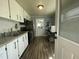Efficient kitchen featuring ample white cabinets, modern hardware, and a stainless steel sink at 214 Grace St, Oxford, NC 27565