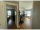 Bright living room with hardwood floors, a ceiling fan, and multiple windows for natural light at 214 Grace St, Oxford, NC 27565