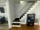 Traditional staircase featuring hardwood steps, carpet and a railing at 214 Grace St, Oxford, NC 27565