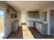 Modern kitchen with gray cabinets, granite countertops, stainless steel appliances, and hardwood floors at 22 Wynd Crest Way, Benson, NC 27504