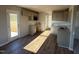Bright kitchen with granite countertops, stainless steel appliances, gray cabinetry, and vinyl wood floors at 22 Wynd Crest Way, Benson, NC 27504