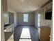 Inviting kitchen and breakfast nook with granite countertops, neutral cabinetry, and plenty of natural light at 22 Wynd Crest Way, Benson, NC 27504