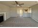Open living space showcasing a fireplace, neutral walls, carpet, and an open floor plan to the kitchen at 22 Wynd Crest Way, Benson, NC 27504