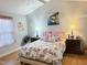 Bright bedroom with floral bedding, matching nightstands, and a window at 254 Pedernales Dr, Smithfield, NC 27577