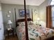 This bedroom features a four poster bed with end tables and lamps on either side at 254 Pedernales Dr, Smithfield, NC 27577