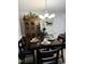 Dining Area with a four person table, chairs, chandelier, and antique hutch at 254 Pedernales Dr, Smithfield, NC 27577