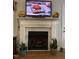 Elegant fireplace with marble surround and decorative mantel at 254 Pedernales Dr, Smithfield, NC 27577
