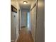 Hallway with light wood floors, white walls, and white closet doors, leading to other rooms at 254 Pedernales Dr, Smithfield, NC 27577