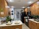 Kitchen with wood cabinets, white countertops, and black appliances at 254 Pedernales Dr, Smithfield, NC 27577