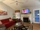 Comfortable living room with fireplace and a doorway leading outside at 254 Pedernales Dr, Smithfield, NC 27577