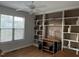 Cozy living room with built-in shelving, a ceiling fan, and natural light from the window at 254 Pedernales Dr, Smithfield, NC 27577