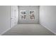 Bedroom features neutral carpet and windows at 256 Chesapeake Commons St # 157, Garner, NC 27529