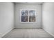 Bedroom with gray carpet and window at 256 Chesapeake Commons St # 157, Garner, NC 27529