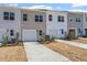 New townhomes feature charming exteriors with attached garages and well-maintained landscaping at 256 Chesapeake Commons St # 157, Garner, NC 27529