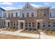 Beautiful brick townhome with multiple windows and landscaping in a well-maintained community at 256 Chesapeake Commons St # 157, Garner, NC 27529