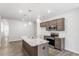 Well-appointed kitchen featuring stainless steel appliances and a granite island at 256 Chesapeake Commons St # 157, Garner, NC 27529