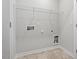 A functional laundry room offers storage solutions with a wire rack and hookups for modern appliances at 256 Chesapeake Commons St # 157, Garner, NC 27529