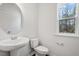 Bathroom features white fixtures, and natural light at 256 Chesapeake Commons St # 157, Garner, NC 27529