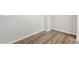 Room showcasing wood-look floors, white walls, and modern electrical outlets at 256 Chesapeake Commons St # 157, Garner, NC 27529