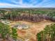 Expansive aerial view of this wooded property surrounded by lush greenery, offering a serene and private setting at 2650 Spring Hill Rd, Spring Hope, NC 27882
