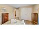 Comfortable bedroom featuring hardwood floors, neutral walls, and convenient closet space at 2650 Spring Hill Rd, Spring Hope, NC 27882