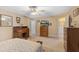 Spacious bedroom features a ceiling fan, a decorative rug, and ensuite access to the bathroom at 2650 Spring Hill Rd, Spring Hope, NC 27882