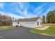 Spacious three-car garage and a paved driveway, offering ample parking and storage at 2650 Spring Hill Rd, Spring Hope, NC 27882