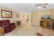 Bright living room featuring a ceiling fan, comfortable seating, and wood-look flooring at 2650 Spring Hill Rd, Spring Hope, NC 27882