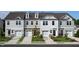 Attractive townhome exteriors featuring varying neutral colors and a one-car garage at 268 Hank Way, Angier, NC 27501