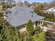 This estate features manicured landscaping, a backyard swimming pool, and a covered outdoor seating area at 2710 Cambridge Rd, Raleigh, NC 27608