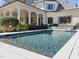 A backyard pool and patio offer a relaxing outdoor living space with an adjacent covered area at 2710 Cambridge Rd, Raleigh, NC 27608