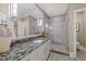 Bathroom featuring a granite countertop, modern lighting, and a glass-enclosed shower at 2710 Cambridge Rd, Raleigh, NC 27608