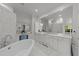 Elegant bathroom features a soaking tub, marble countertops, and custom cabinetry, and spa-like shower at 2710 Cambridge Rd, Raleigh, NC 27608