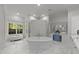 Elegant bathroom showcasing a freestanding tub, mosaic-tiled shower, vanity, and large window for natural light at 2710 Cambridge Rd, Raleigh, NC 27608