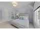 Bright bedroom with carpeted flooring, natural light, and ensuite access at 2710 Cambridge Rd, Raleigh, NC 27608